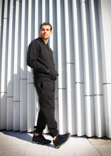 Cargar imagen en el visor de la galería, Our black hoodie is made with ultra soft cotton fleece with a cozy brushed interior. This is an exceptionally high - quality and comfortable sweatshirt. - 400gsm Heavyweight GOTS Organic Cotton with brushed interior - 100% GOTS Organic Cotton body - 100% GOTS Organic Cotton double-folded flat knit cotton ribbing